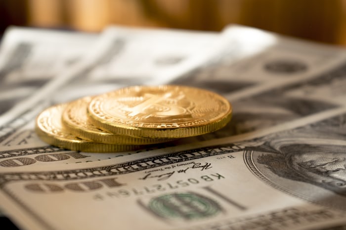 a pile of paper money and coins